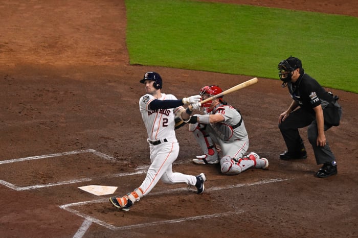 Astros third baseman Alex Bregman hits a double against the Phillies in Game 1 of the World Series.